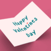 Open Valentine card on pink background