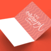 Open Valentine's Day card on orange background