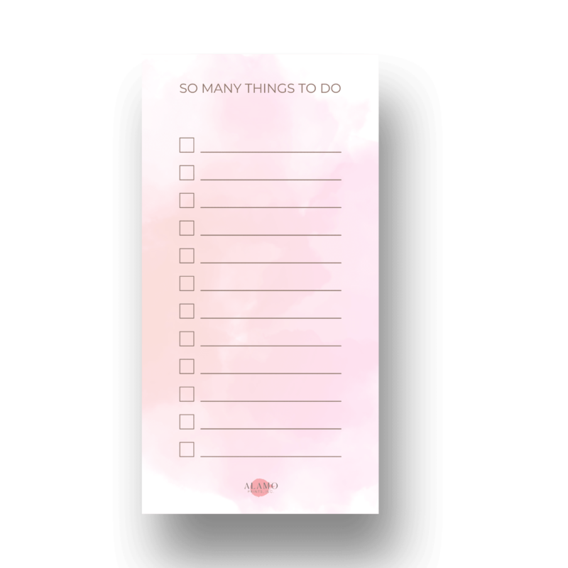 Pink checklist notepad with checkboxes and lines.