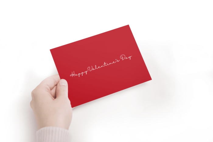 Hand holding Valentine's Day card