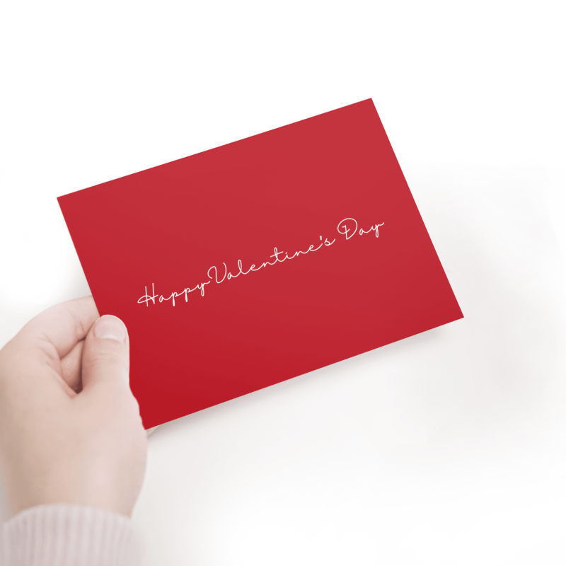Hand holding Valentine's Day card