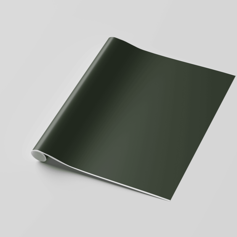Rolled green wallpaper on white surface