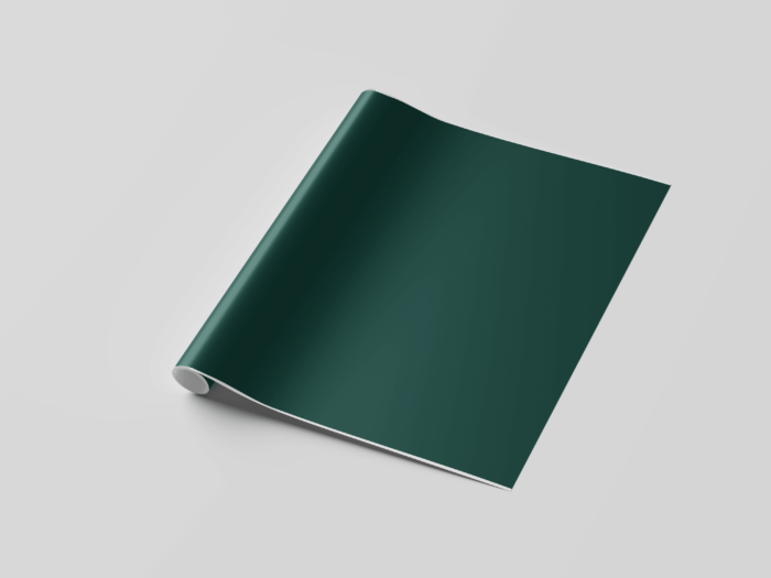 Rolled green wallpaper on white background.