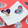 Colorful alien-themed stickers on a greeting card.