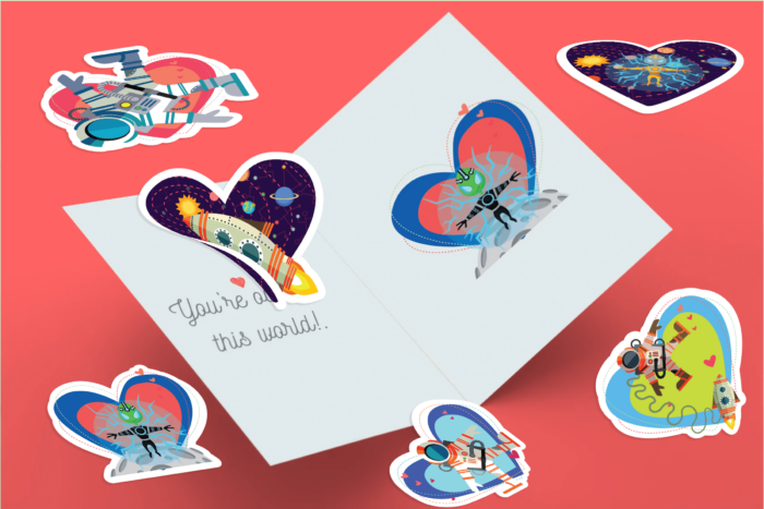 Colorful alien-themed stickers on a greeting card.