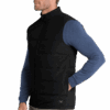 Man wearing black vest and blue shirt.
