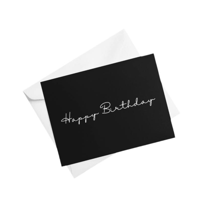 Black birthday card on white envelope