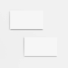 Two blank white business cards on white background