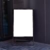 Blank vertical sandwich board outside building entrance