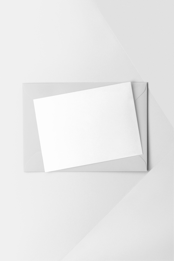 Blank envelope with white card on top