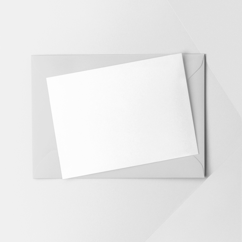 Blank envelope with white card on top