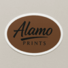 Alamo Prints logo on brown oval background.