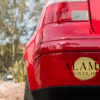 Red car bumper with Alamo Prints, Inc. logo.
