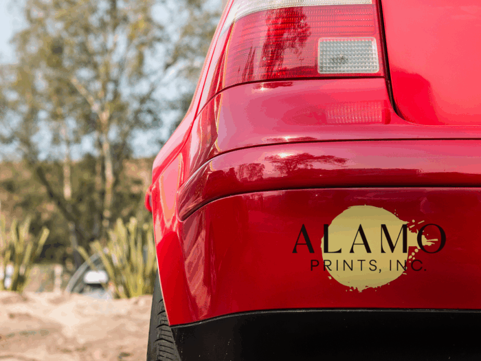 Red car bumper with Alamo Prints, Inc. logo.